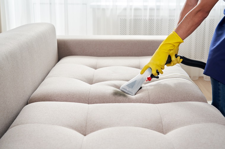 upholstery stain cleaning by professional cleaner 