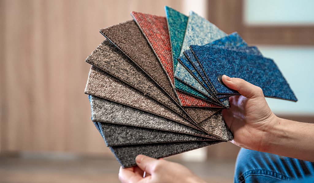 hand holding carpet samples